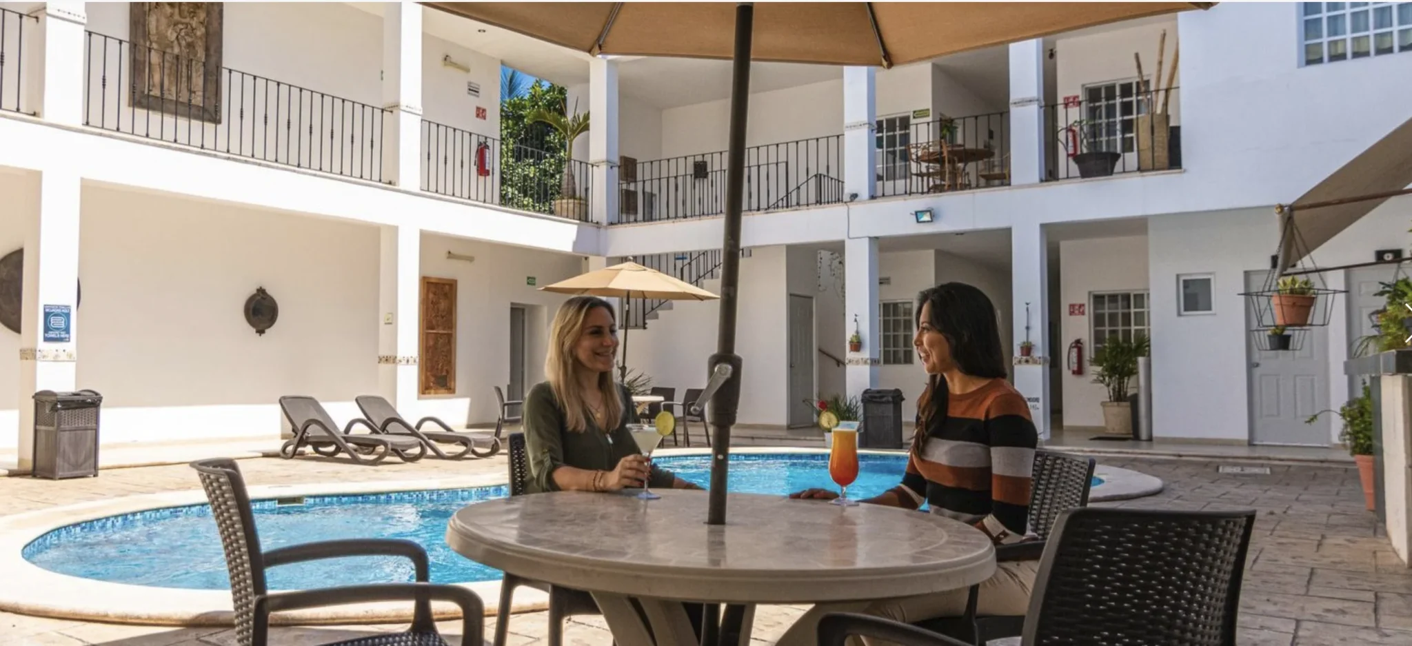 Hotel pool and relaxation area where participants stay during the Spanish immersion program in Yucatán.